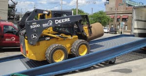Forklift unloading sod using a HandiRamp yard ramp